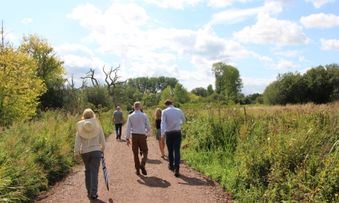 Visitors enjoying the newly-surfaced west-east path at Fishlake Meadows Nature Reserve