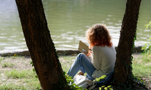 Reading by a river © Pexels