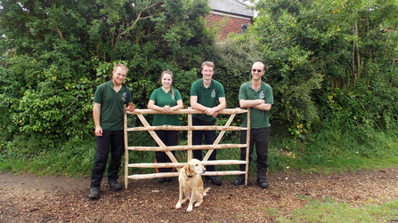 Woodland apprentices with an ash gate hurdle