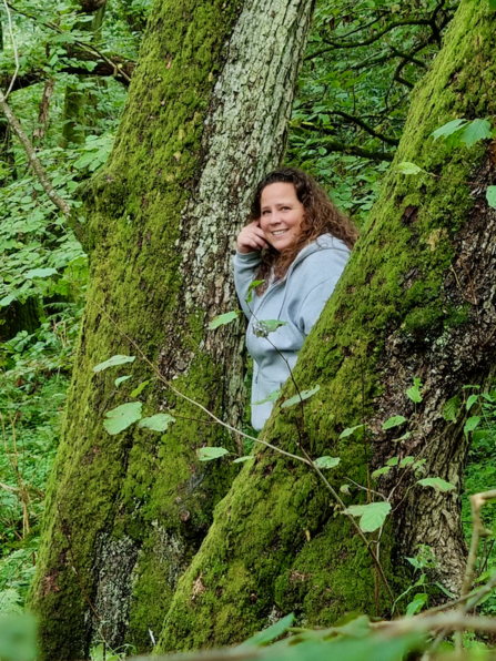 Adore Your Outdoors founder, Sonya, standing in woodland