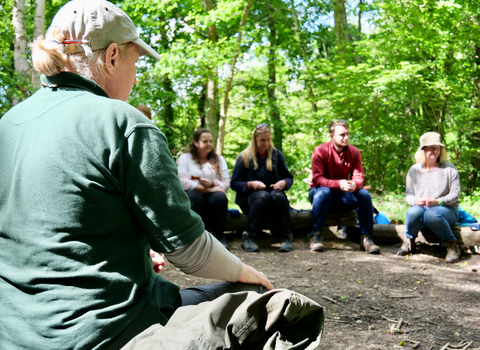 Hampshire & isle of wight wildlife trust staff delivering forest school training to a group of teachers and leaders