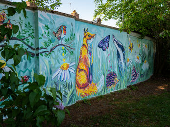 A colourful wildlife mural painted on a wall 