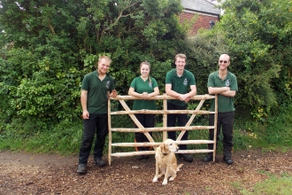 Woodland apprentices with an ash gate hurdle