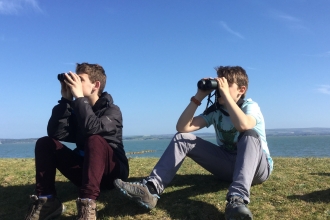 Young Naturalists watching avocets