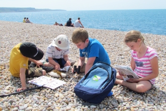Children at Chesil Beach Dorset © Nadine Atchison-Balmond