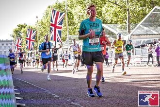 Ben running surrounded by other runners during the london Marathon
