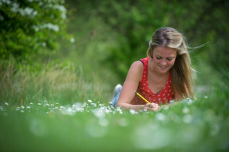 Woman writing in nature © Matthew Roberts