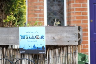 Wilder portsmouth plaque on bin shed