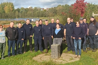 A group photo of a large group of people looking towards the camera