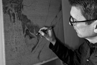 Artist Cy Baker drawing a red squirrel from Alverstone Mead Nature Reserve