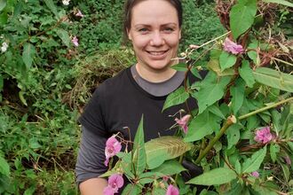 Holly Fitzgerald helping control Himalayan balsam in the New Forest. 
