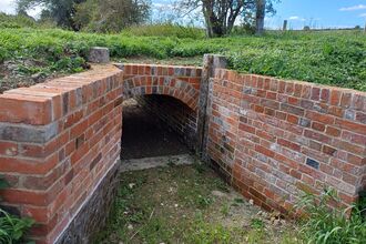 A newly repaired brick bridge