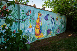 A colourful wildlife mural painted on a wall 