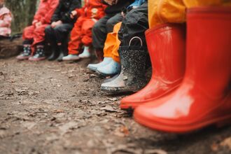 Row of children's welly boots.