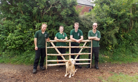 Woodland apprentices with an ash gate hurdle