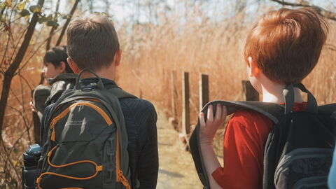 Wildlife Ranger children walking along a lakeside path.