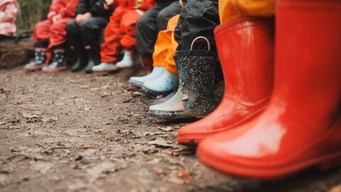 Row of children's welly boots.