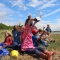 Families at a group story session at Milton Locks nature reserve