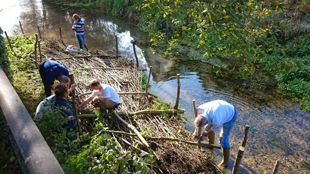 Volunteers implementing natural flood management measures