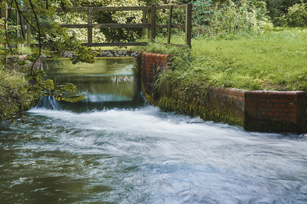 Manmade waterfall over a weir in Alresford © Harry Bradley