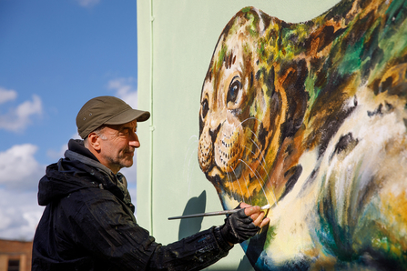 Artist ATM painting Harbour seal mural, Newport IOW