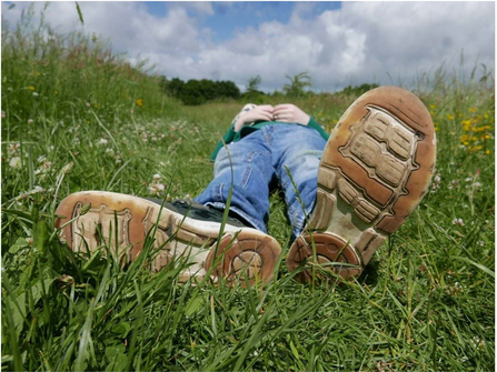 close up of shoes, person laying down