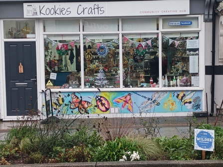 Local artist Joanna Rose Tidey mural on the bottom panel of Kookies Crafts