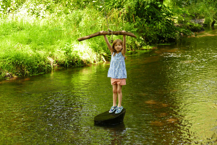 Child playing in river © Sally Broom