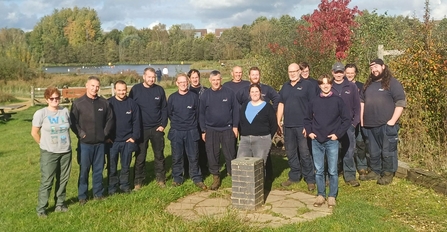 A group photo of a large group of people looking towards the camera