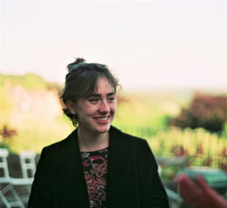 A portrait photo of a woman smiling