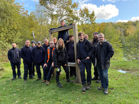A large group of people standing for a photo in an outdoor space