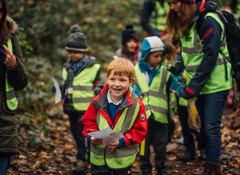 Children walking through woodland 