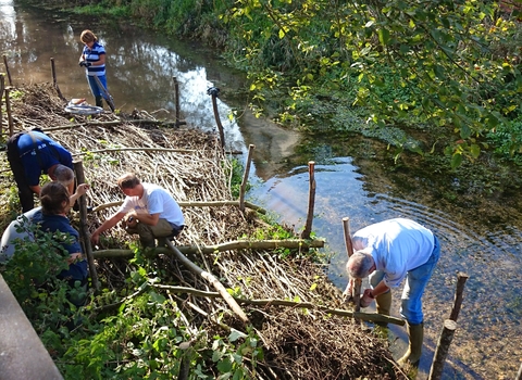 Volunteers implementing natural flood management measures