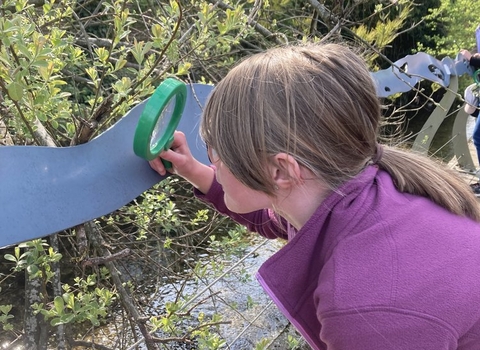 Child tests the Nature (Curious) Explorer Backpack, developed through the 'Living by the Ash Tree Waters' project © James Aldridge