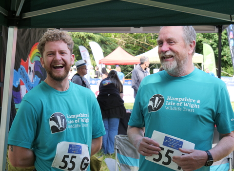 Two runners laughing 