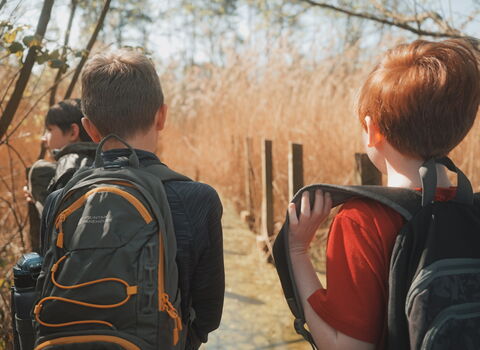 Wildlife Ranger children walking along a lakeside path.